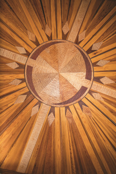 Intricate craftsmanship abounds throughout the
5,800-square-foot timber frame home, including
this sunburst Jason designed himself.