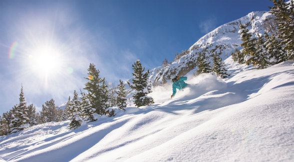 MORE THAN 100 RUNS. The members-only ski mountain offers 2,700 skiable acres and is marked by a 2,700-foot vertical drop. The diverse terrain varies from gentle beginnerâ€™s slopes to tree skiing and expert chutes. [Photo Credit: Ryan Turner Photography]