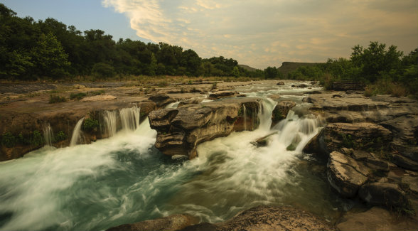 HILL COUNTRY | A late spring thunderstorm moves over the Dolan Falls, the largest waterfall by volume in Texas.