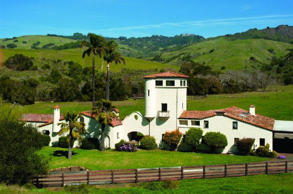 San Francisco architect Julia Morgan spent decades designing scores of structures at San Simeon, including the poultry ranch manager’s house (foreground) and the Hearst Castle (background).